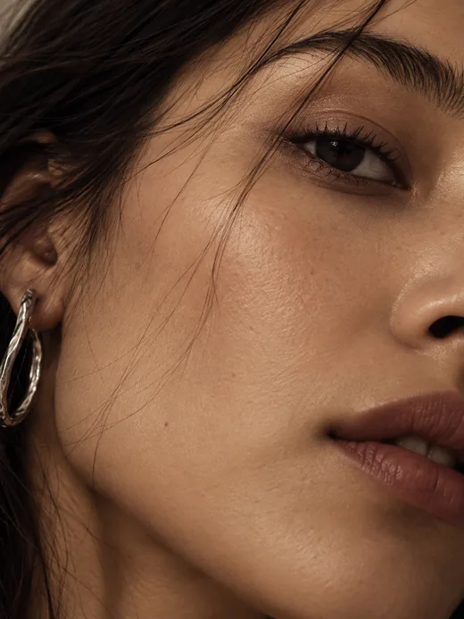 A close portrait with a silver earring