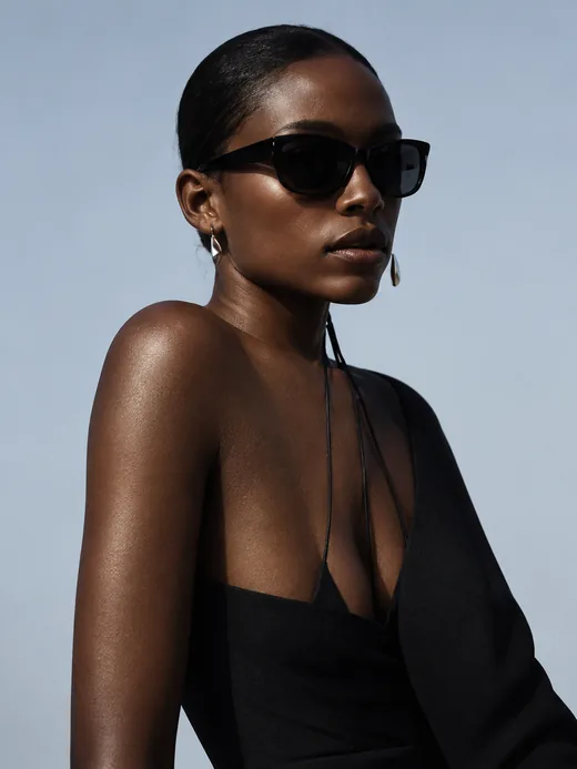 A black draped top with sunglasses